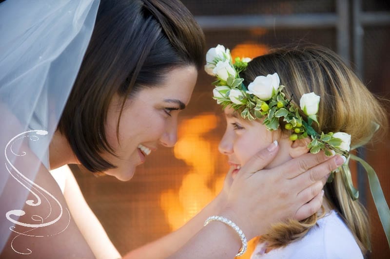 Lindsay shares a tender moment with her flower girl shortly after her ceremony on the spa deck.