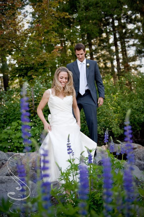 Chelsea and Jon make their way into the lupine fields after the ceremony.