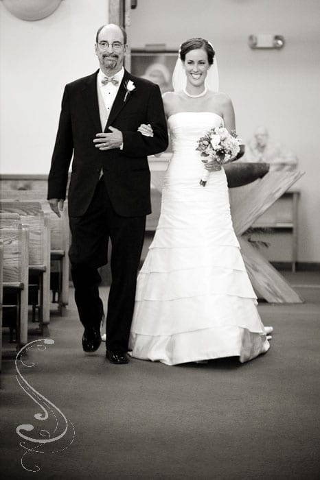 Katy being escorted down the aisle by her dad at St. Theresa Catholic Church in south Lake Tahoe.