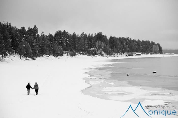 couple walking along frozen beach