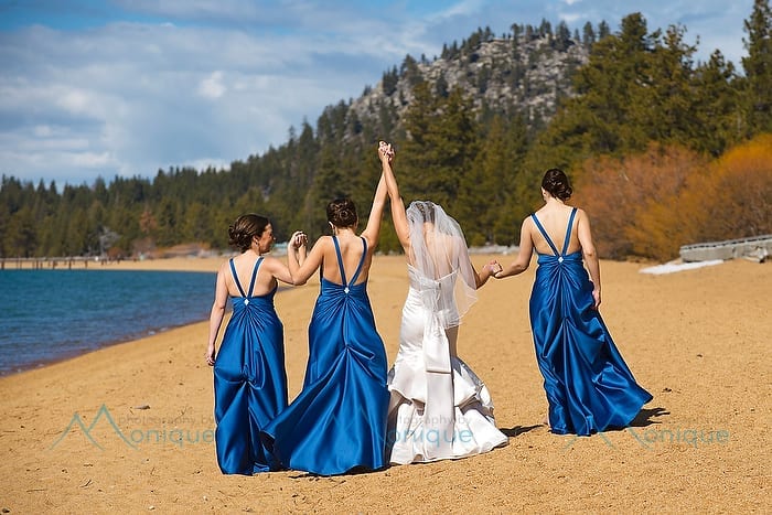 bride and bridesmaids on beach