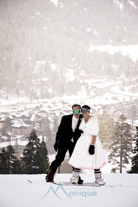 bride and groom on snowboards at Squaw Valley