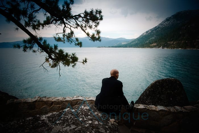 groom waiting by the lake