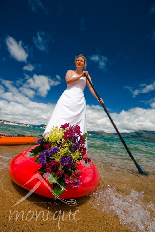 bride on stand up paddle board in lake tahoe