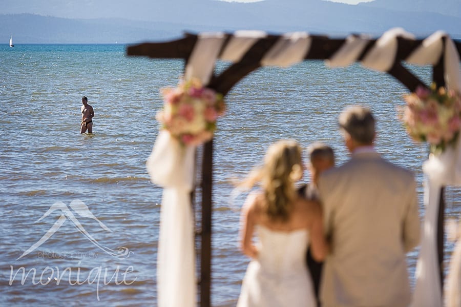 Sometimes the public aspect of a Lake tahoe wedding can add some humorous moments to the ceremony or portrait session. The bride kinda thought that the groom had hired this guy as a practical joke. But he didn't, it was just a Tahoe tourist who wanted to watch the ceremony.