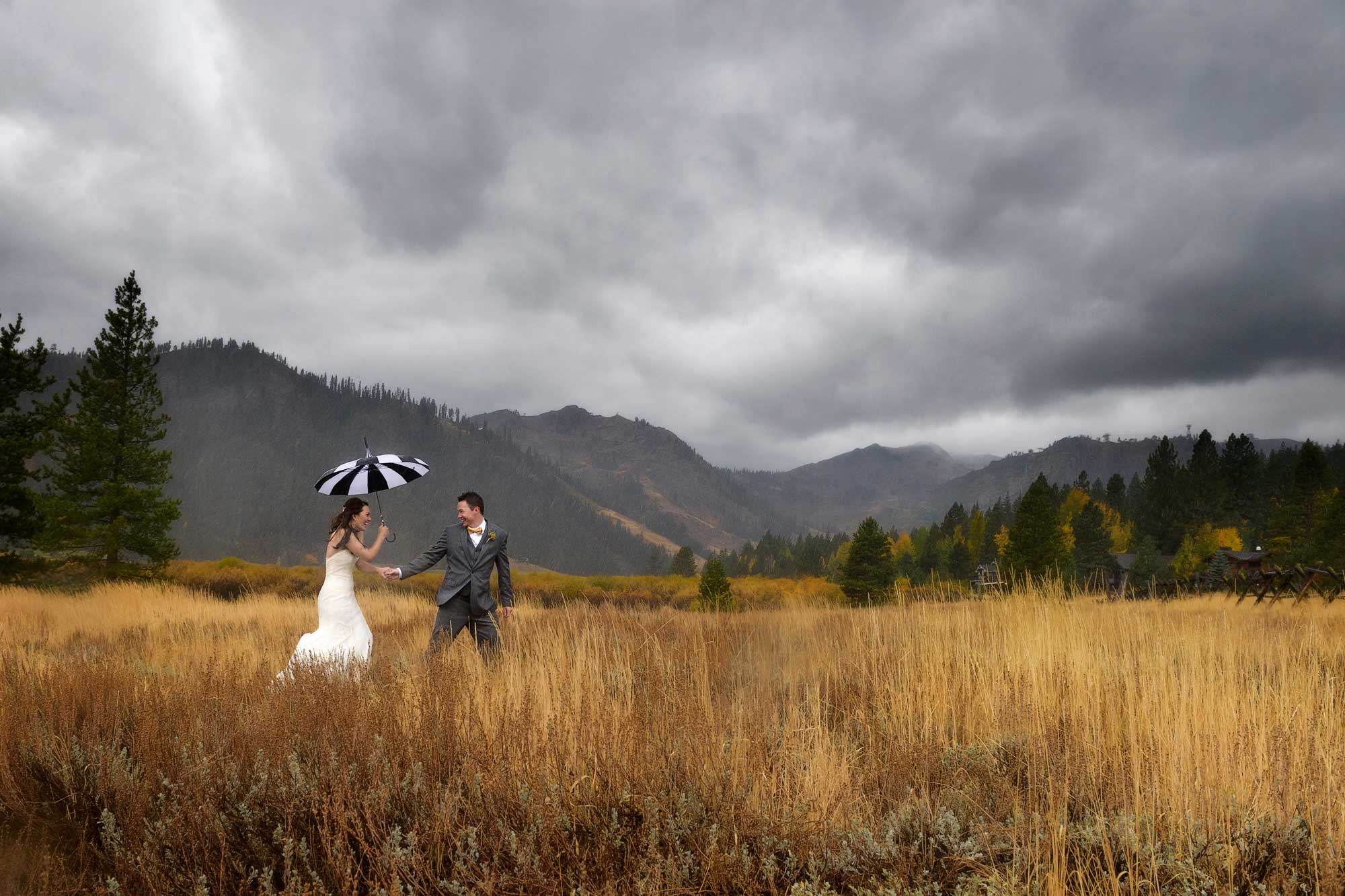 squaw valley wedding photograph of couple in meadow in the rain