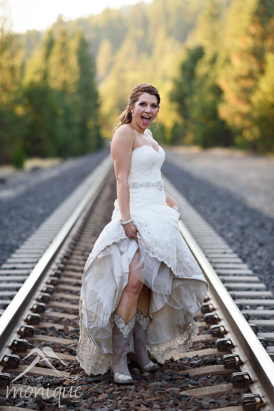 Twenty Mile House wedding photography cowgirl bride portrait on the train tracks