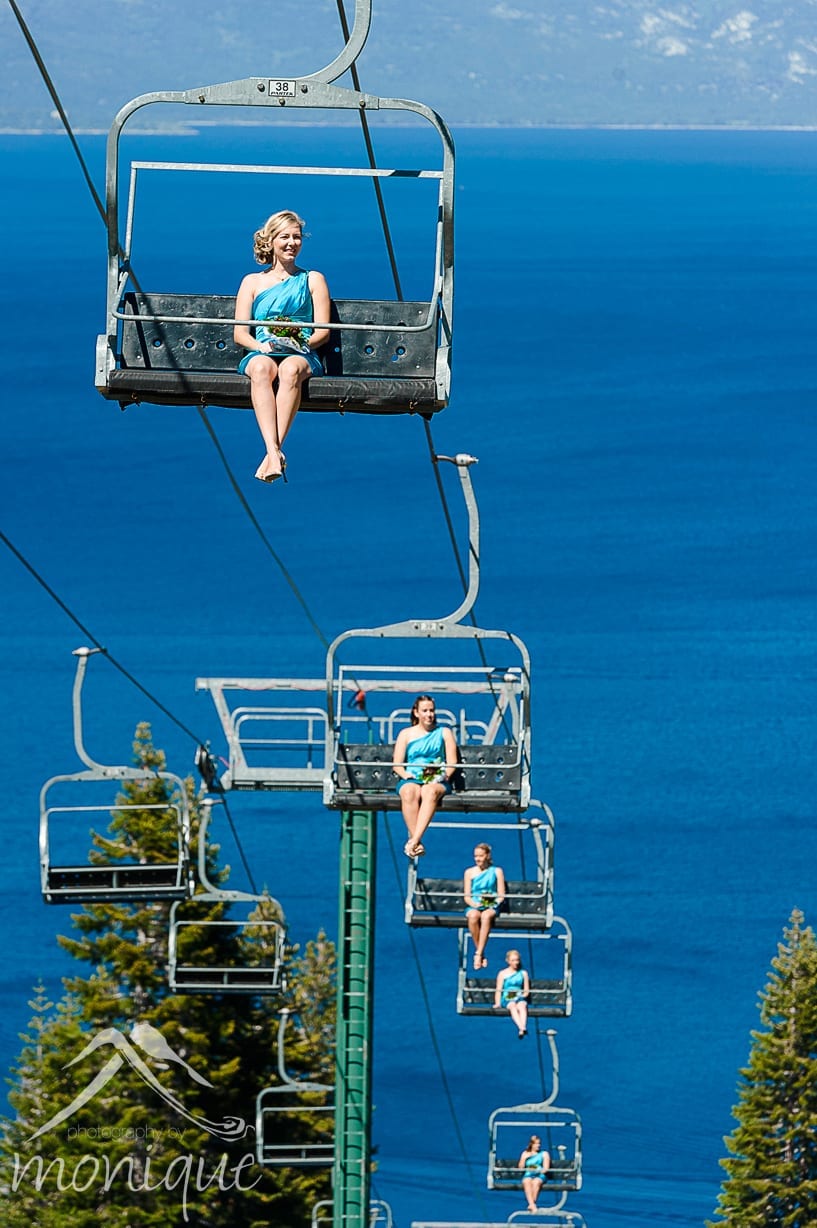 Homewood Mountain Ski Resort wedding photography by Photography by Monique on top of the mountain with Lake Tahoe in the background and wedding party riding the chair lift