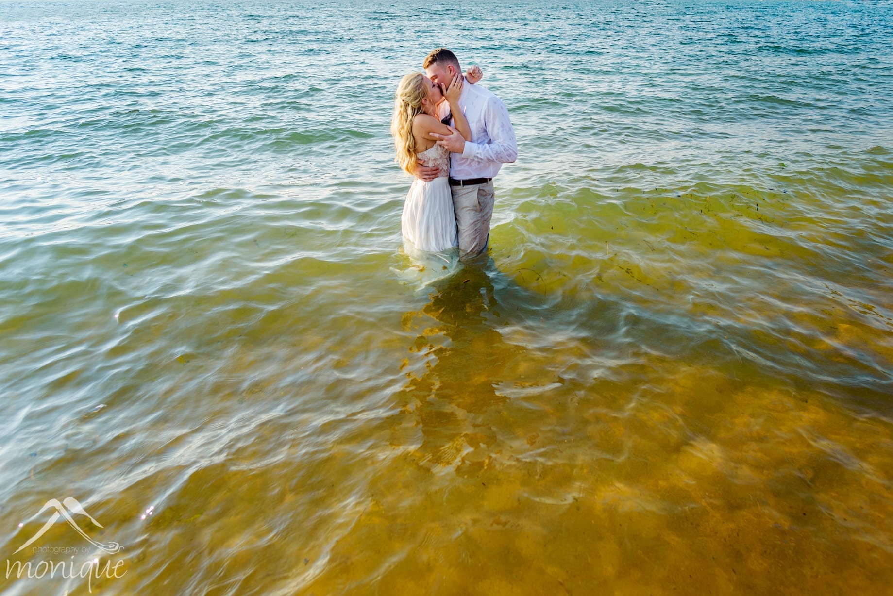 Lake Tahoe wedding photography at The Landing with the couple in the water
