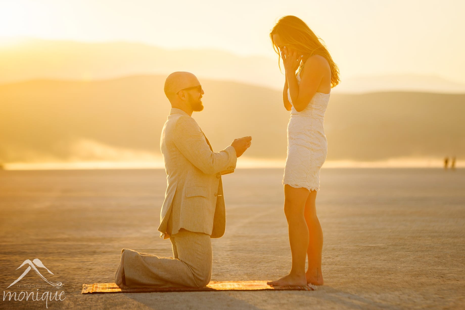 Burning Man 2018 engagement photography, sunset on the playa, surprise ring proposal