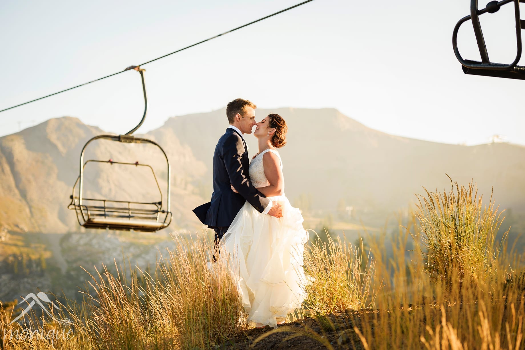 Squaw Valley High Camp wedding photography at sunset with the chair lifts the Palisades in the background by local photographers Photography by Monique