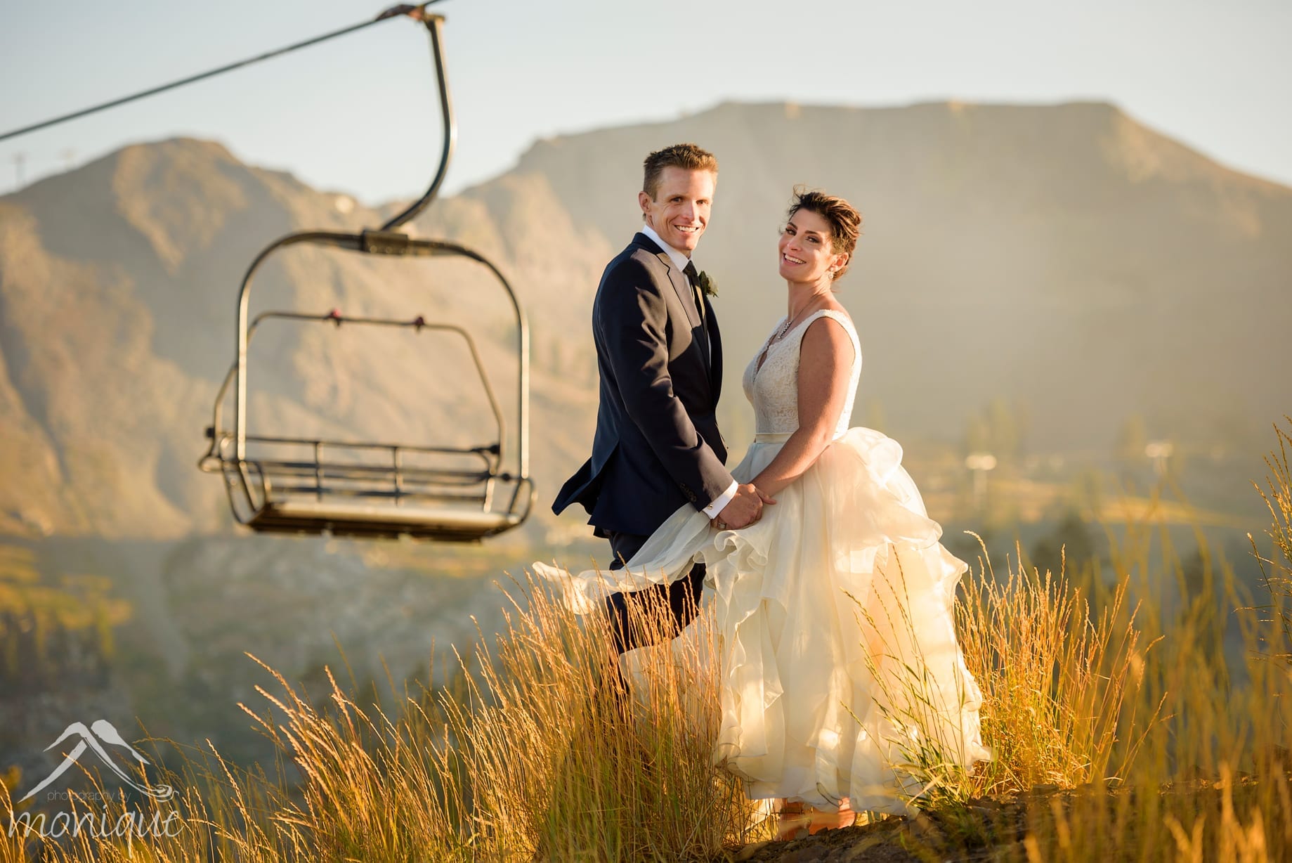 Squaw Valley High Camp wedding photography at sunset with the chair lifts the Palisades in the background by local photographers Photography by Monique