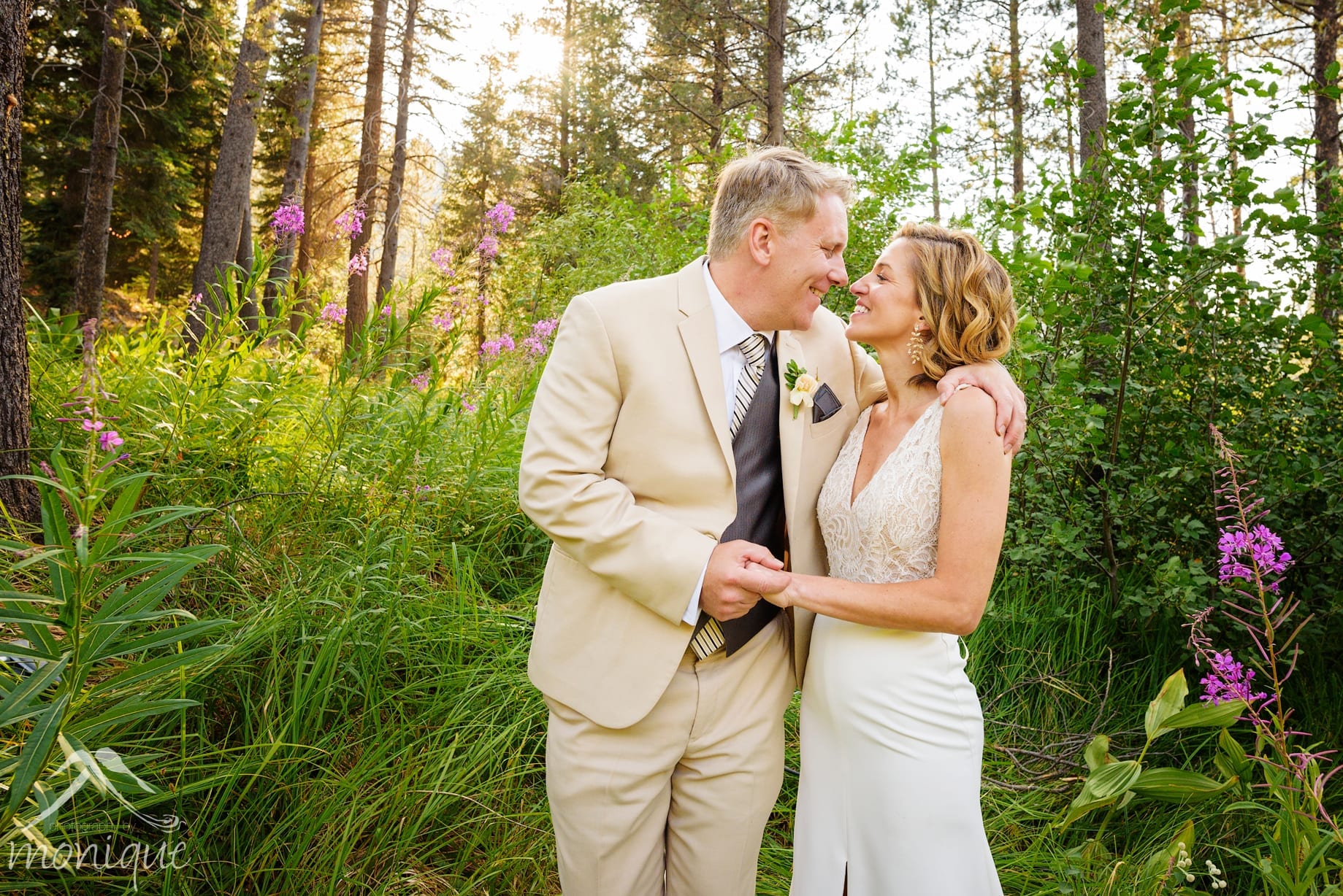 Bullshead Lodge Truckee River wedding photography with the bride and groom in the forest with wild flowers