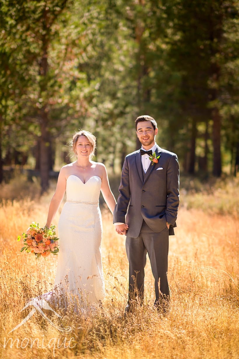 Truckee wedding photography at Lahontan Golf Club with a portrait of the bride and groom in a filed of golden yellow grasses