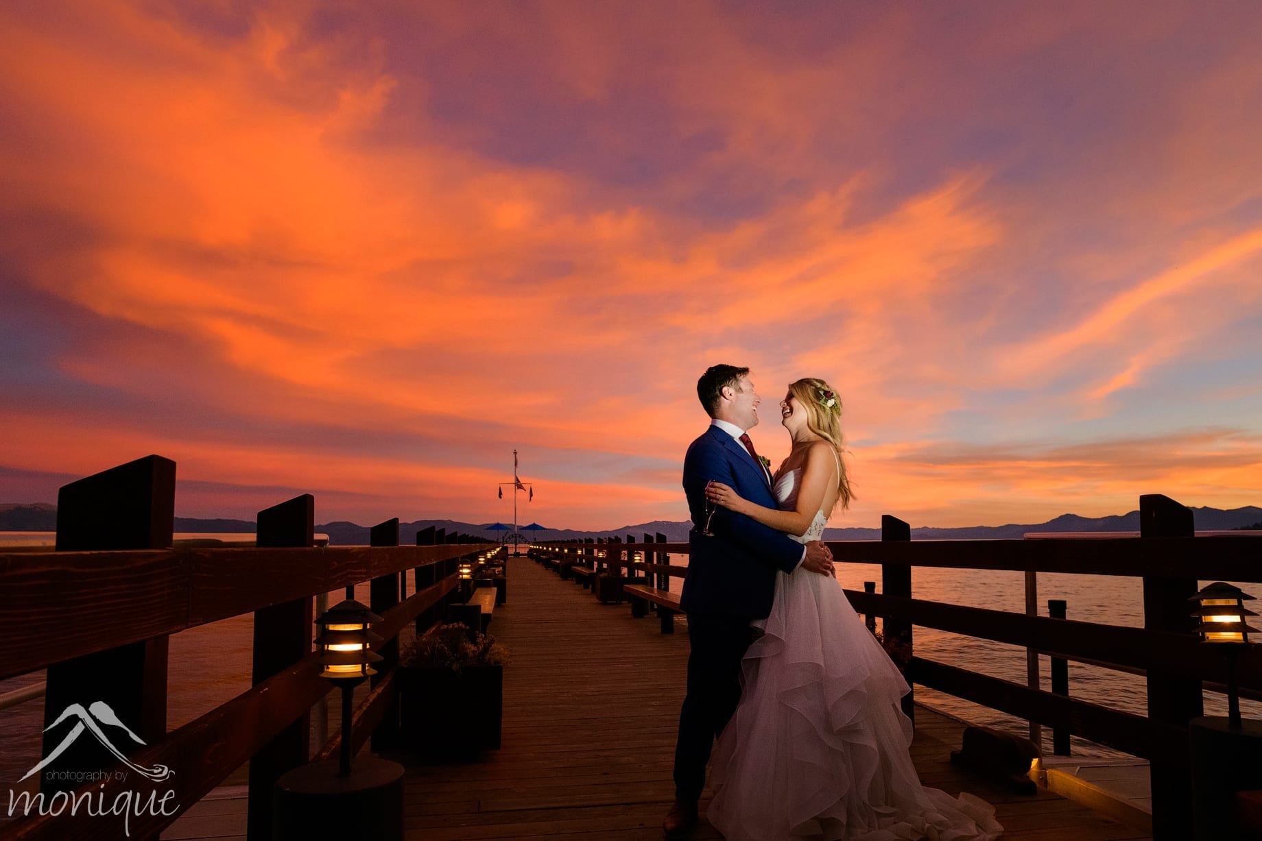 Gar Woods wedding photography with the bride and groom on the pier with a spectacular sunset