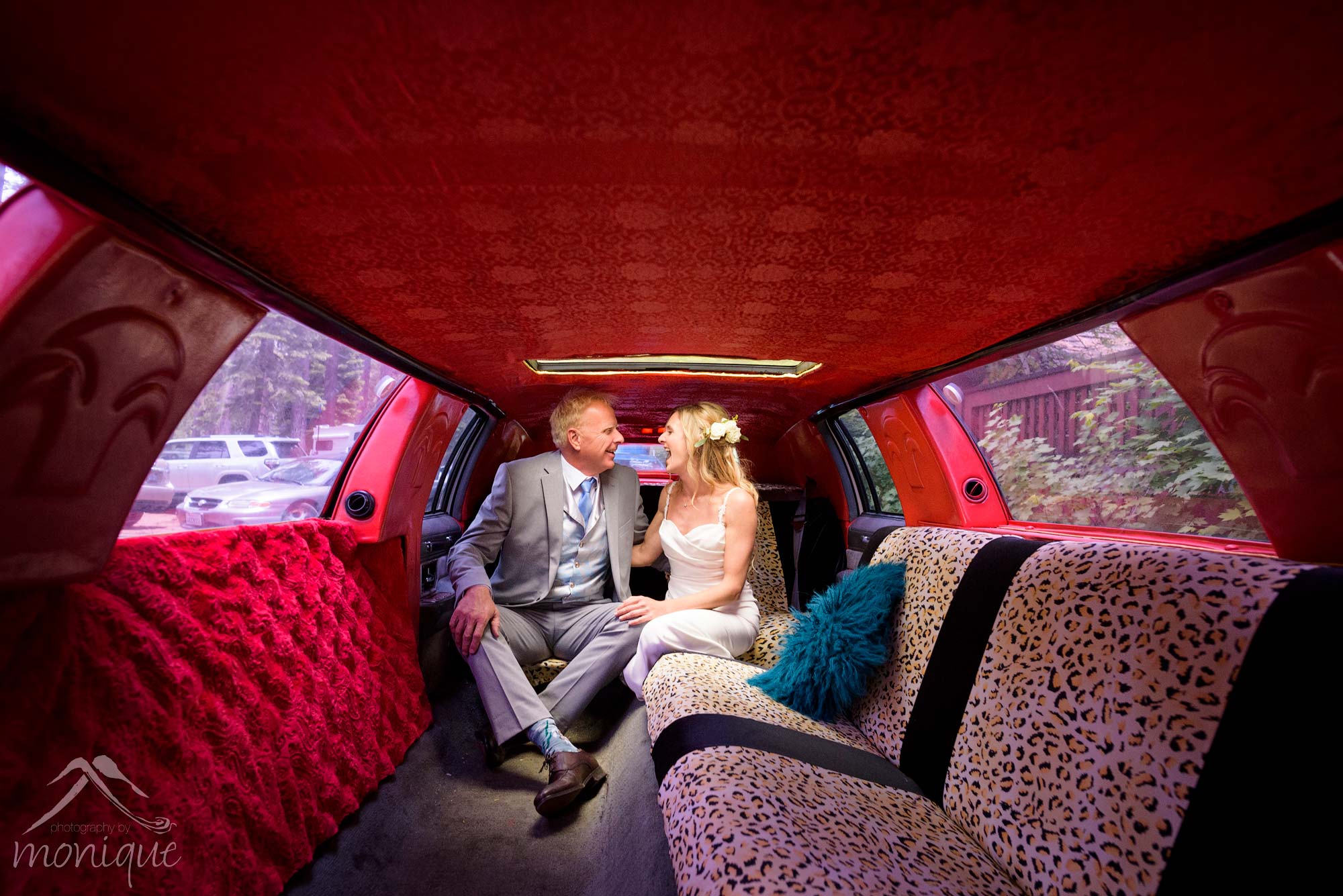 bride and groom inside funky limousine