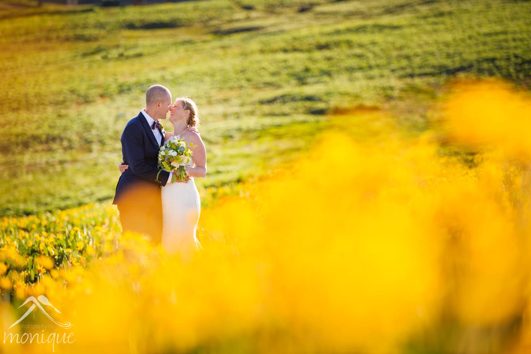 Squaw Valley High Camp wedding photography with the bride and groom in the yellow wild flowers