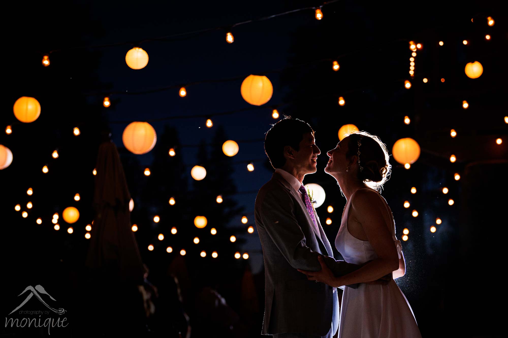bride and groom wedding photo under oban style lights