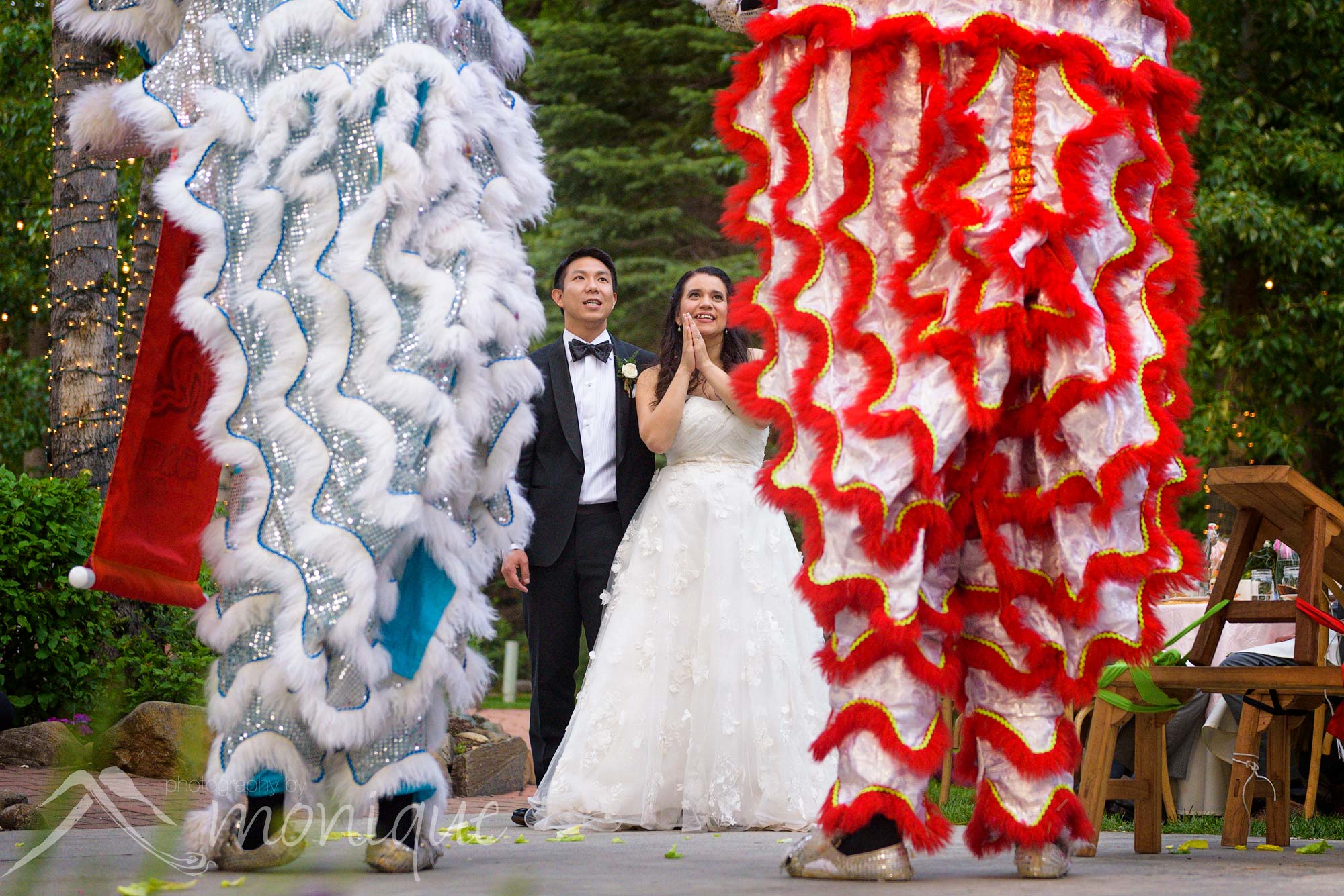 The best Twenty Mile House wedding photography with the Chinese Lion dance being performed during the reception