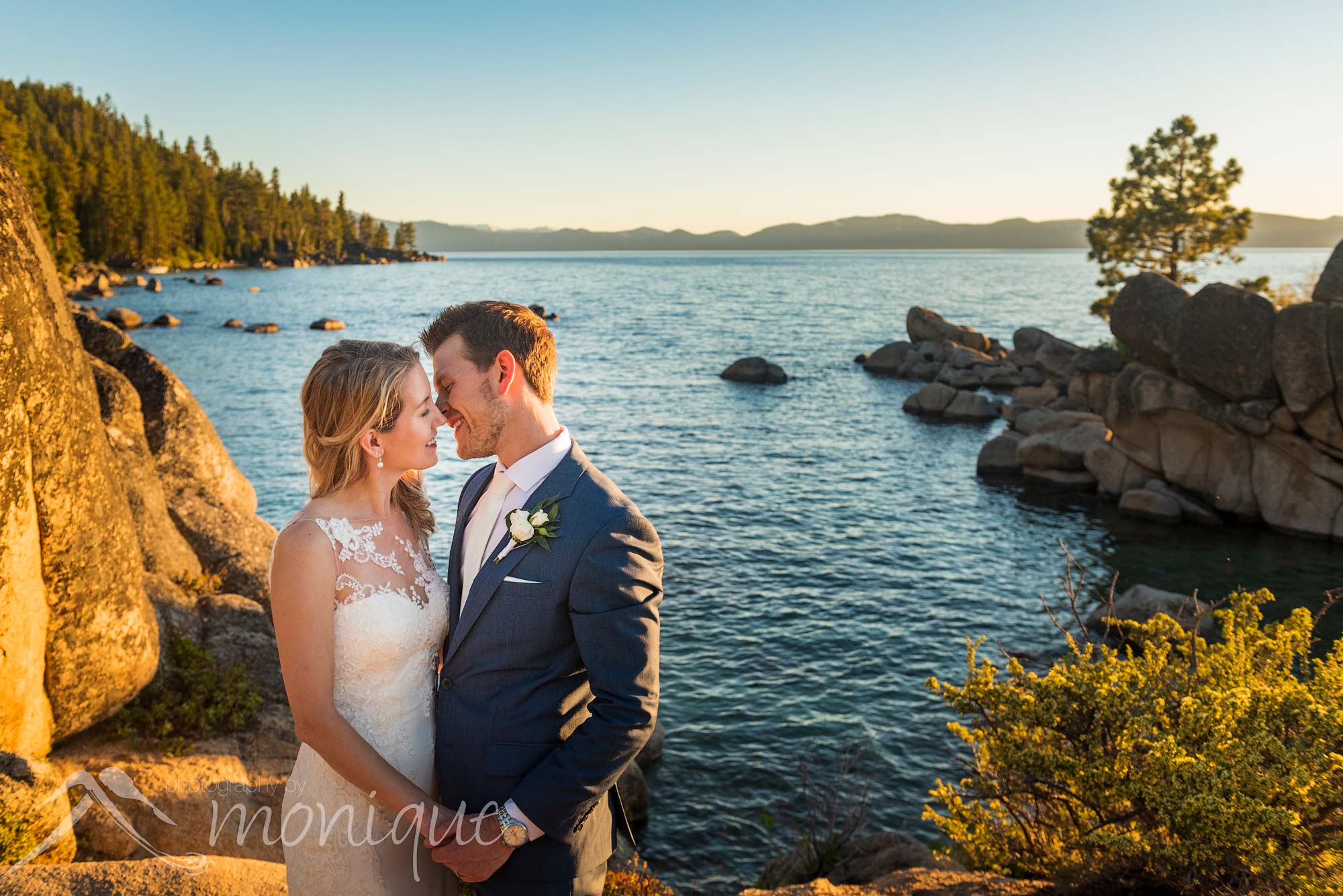 Lake Tahoe Covid-19 elopement photography featuring the bride and groom at a beach with boulders by Photography by Monique adventure photographers 