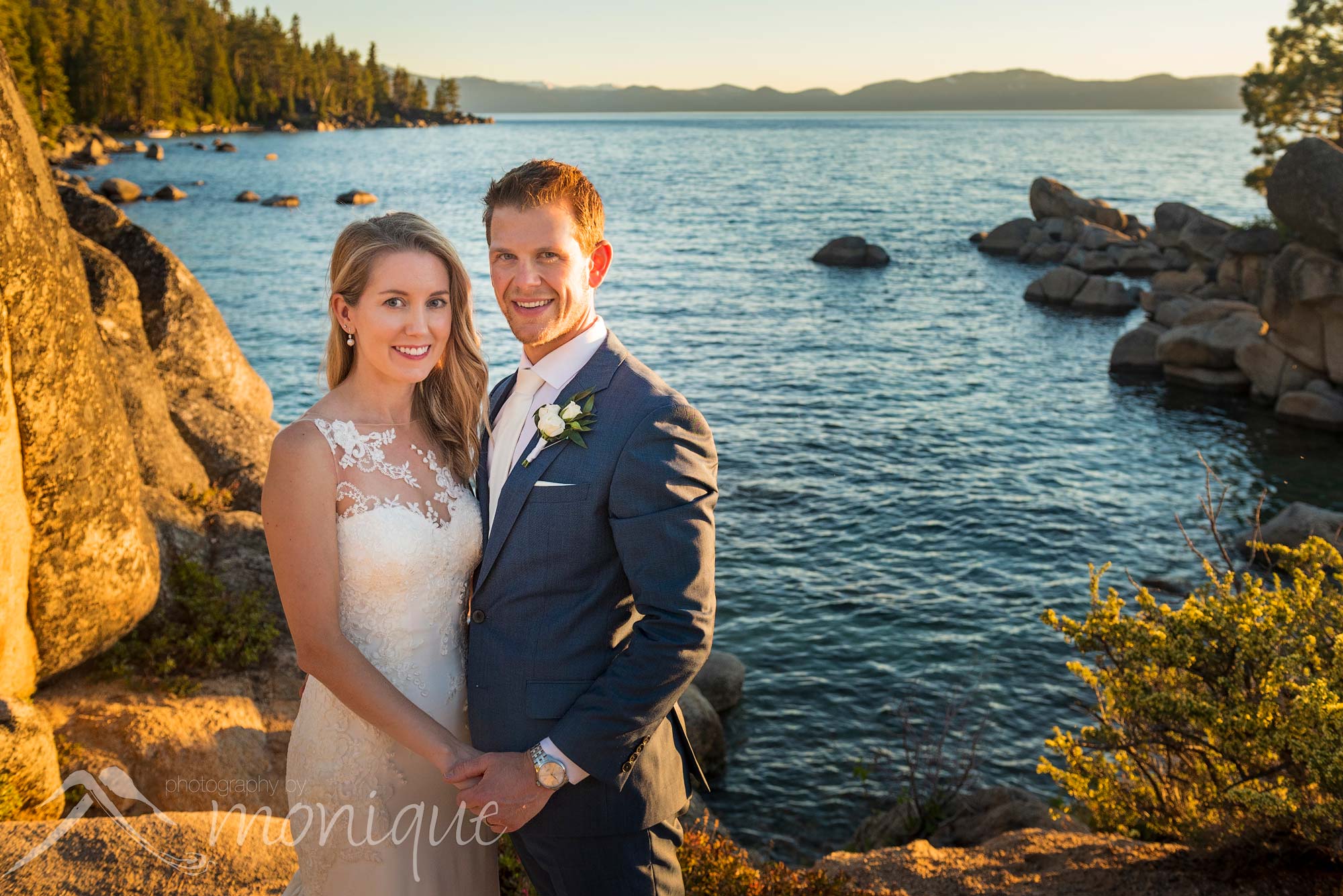 Lake Tahoe Covid-19 elopement photography featuring the bride and groom at a beach with boulders by Photography by Monique adventure photographers 