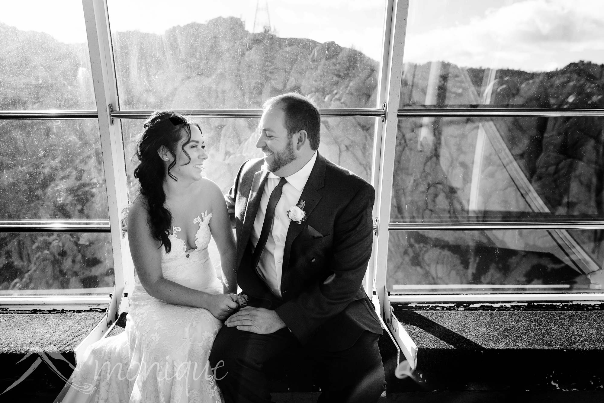 Palisades Tahoe wedding photography with the bride and groom in the tram riding up to High Camp