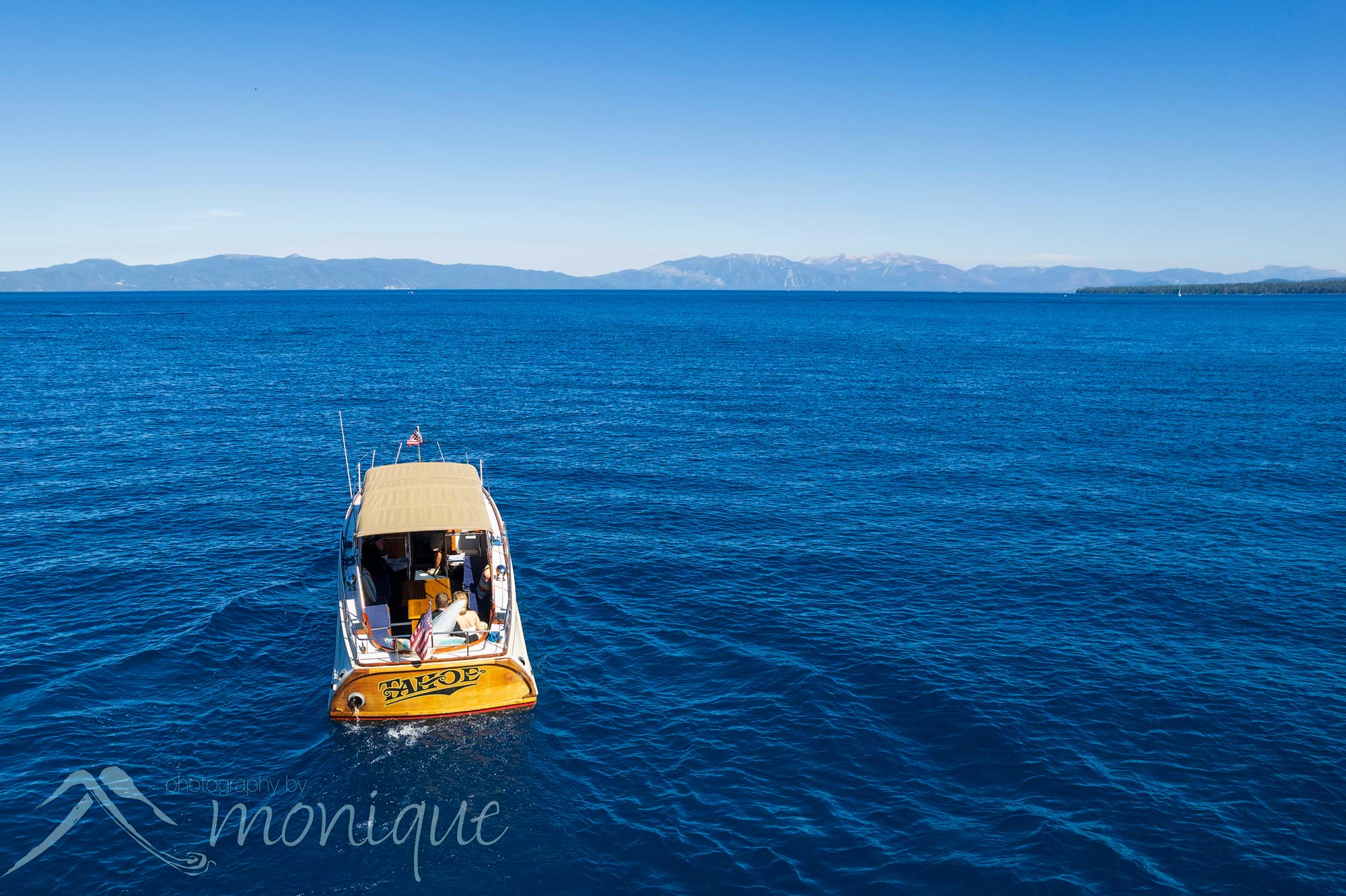 Lake Tahoe private estate wedding photography with the bride and groom Rachel and Bruce Taylor on a boat The Tahoe, Photography by Monique